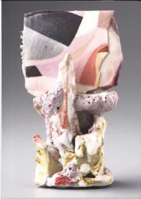 a ceramic vase with a pink and white pattern on it